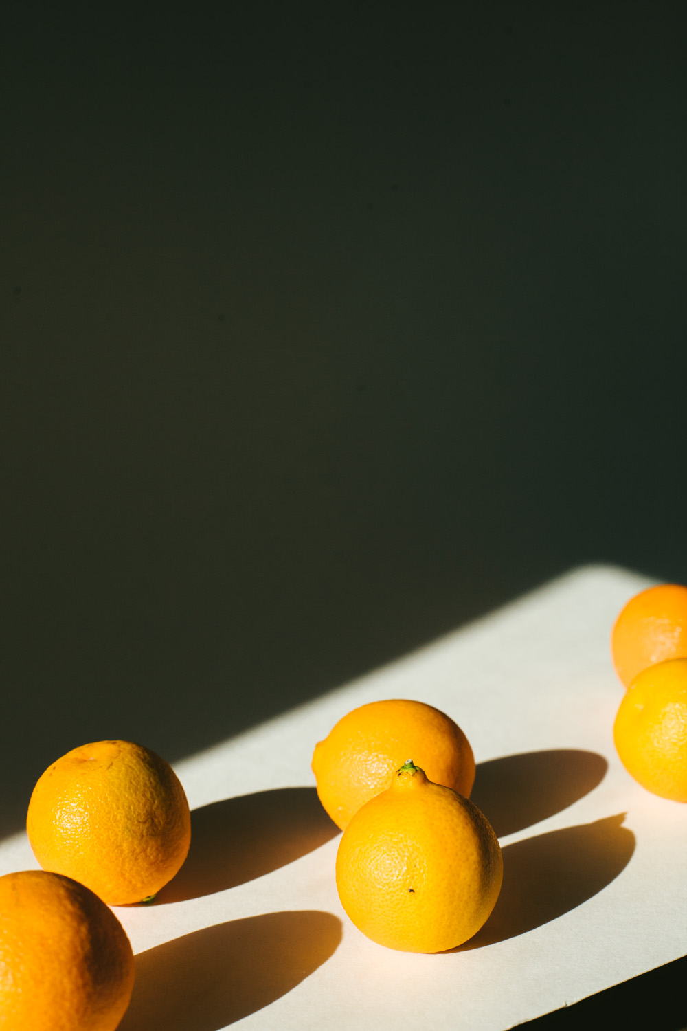 photo of oranges in hard light